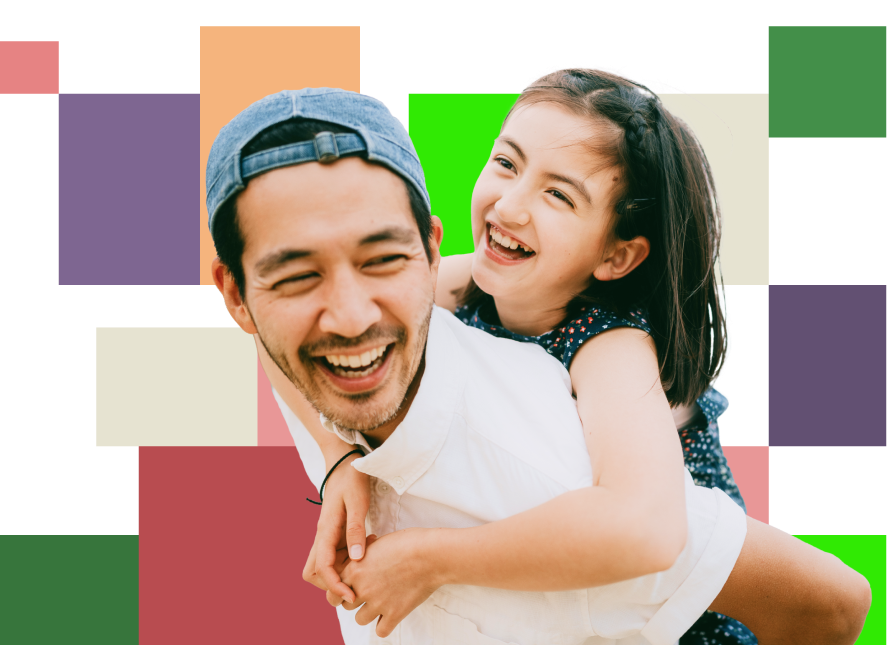 Healthy adult and child smiling and enjoying each other's company