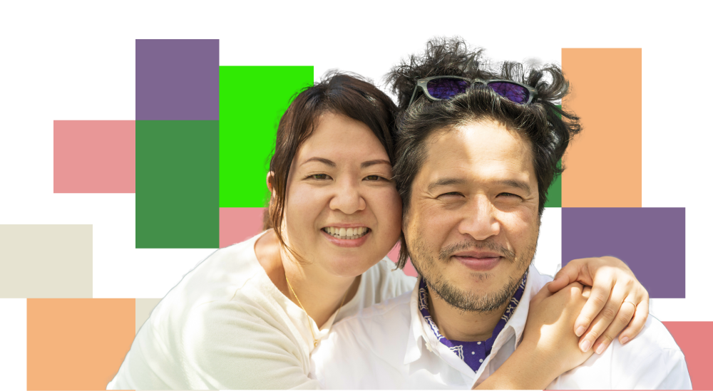 Two happy, healthy adults smiling because they are pleased with their wellness journey